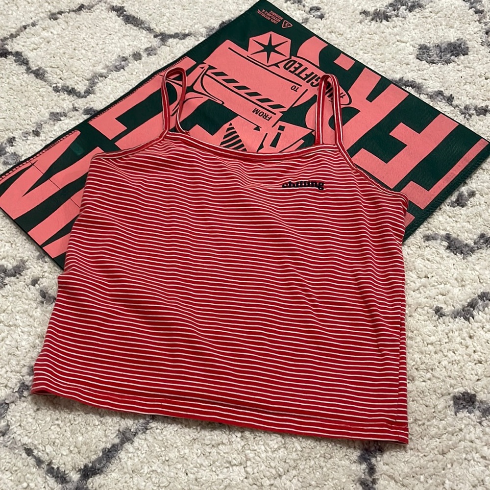 Red and white stripped tank top. “Chilling”